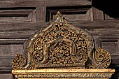 Chiang Mai - The Wat Phan Tao temple. Detail of the right frontal window of the Wihan. 